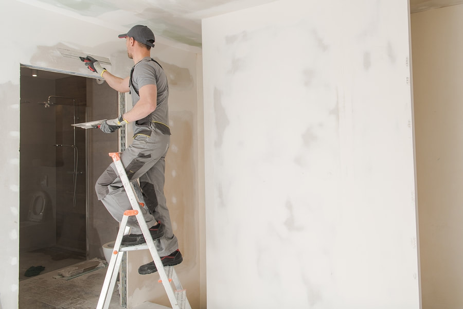 man painting a wall