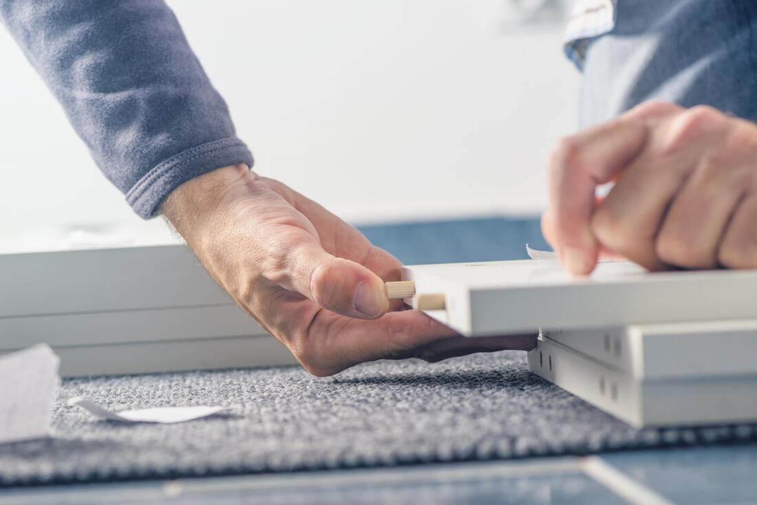 man assembling a furniture