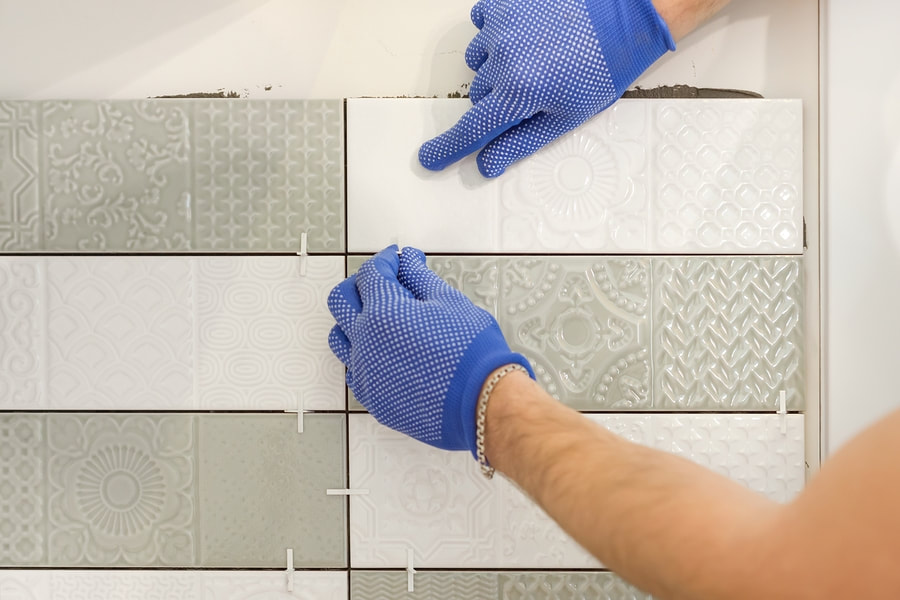 man installing a tiles